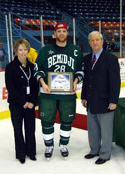 BSU captain Jean-Guy Gervais, here with from CHA commissioner Bob Peters and assistant commissioner for operations Deb Slough, was tournament MVP (photos: Matt Mackinder).