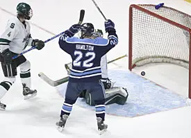 Mike Hamilton celebrates regional MOP John Hopson's first goal Sunday (photos: Melissa Wade).