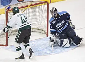 This Tim Crowder shot tucks inside the post as Ben Bishop looks on.