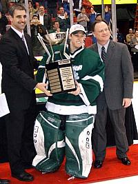 Michigan State's Jeff Lerg accepts the CCHA postseason tournament MVP award (photo: Matt Mackinder).