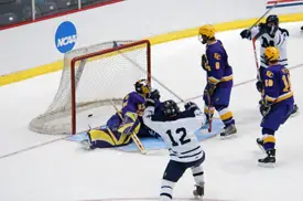 Darwin Hunt (12) celebrates John Sales' game-tying goal.