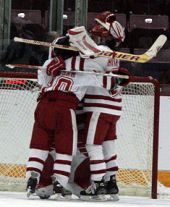 Wisconsin players mob Jessie Vetter after their victory. (Photo: Ryan Coleman)