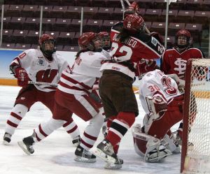 Goalie Jessie Vetter remains amidst the chaos surrounding her. (Photo: Ryan Coleman)