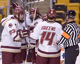 Brian O'Hanley (l.) and Matt Greene help BC captain Peter Harrold celebrate his goal at the Beanpot Monday.