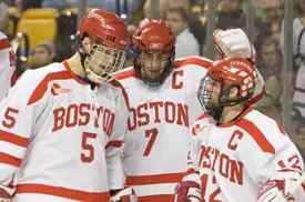 Seniors John Laliberte, David Van der Gulik and Brad Zancanaro celebrate Van der Gulik's second goal Friday (photo: Melissa Wade).