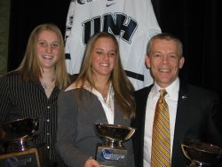 UNH's Sadie Wright-Ward, Sam Faber, and Brian McCloskey pose with their trophies.