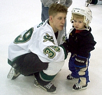 Adam Krug with his son at a 'Skate With The Warriors' event (photo: Matt Mackinder).