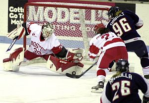 Boston University netminder Allyse Wilcox (shown here stoning Connecticut's Dominique Thibault) has drawn plaudits for her performance (photos: Boston University media services).