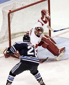 Maine's Teddy Purcell (here stopped by BU's John Curry) departed college after one year with the Black Bears (photo: Boston University athletics).