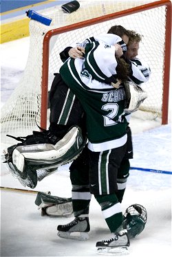 Jeff Lerg is mobbed by Bryan Lerg and Nick Sucharski at the final buzzer. (photo: Melissa Wade)