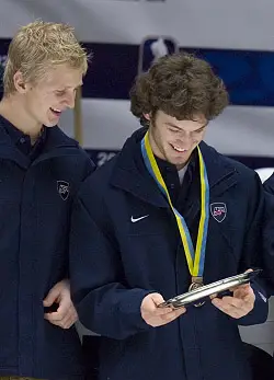 Brian Lee (l.) and Taylor Chorney enjoy Team USA's bronze medal from the WJC.