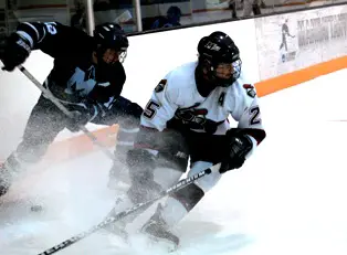 Middlebury's Darwin Hunt and Manhattanville's Chris Wanchulak battle for position.