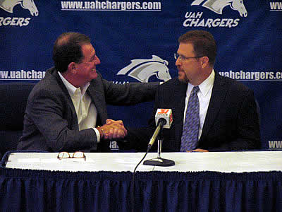 UAH athletics director Jim Harris congratulates Danton Cole at the press conference (photo: Jamie Gilliam, UAH Sports Information).