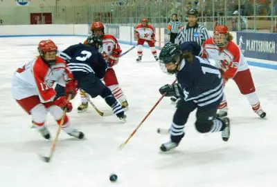 Kayla  McDougall chases the puck for Plattsburgh. / Bill Roberts 