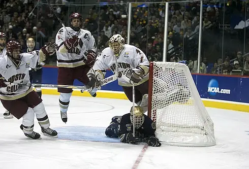 BC goalie John Muse goes airborne in the title game against Notre Dame (photo: Jim Rosvold.)