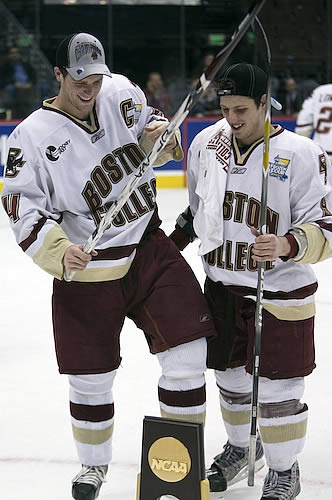 Nathan Gerbe (r.) with Boston College captain Mike Brennan and the NCAA championship trophy (photo: Jim Rosvold).