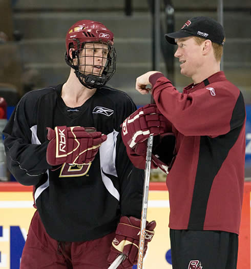 Boston College captain Mike Brennan talks with assistant coach Greg Brown at Friday's practice (photo: Melissa Wade.)