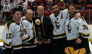 St. Norbert's captains receive the championship trophy.