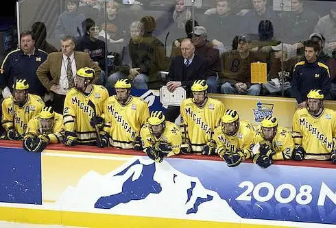 Michigan's bench looks dejected in the first period of Thursday's semifinal after Notre Dame took an early 2-0 lead (photo: Jim Rosvold.)