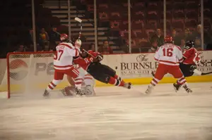 Matt Gilroy gets physical around his net. Photo by: Candace Horgan