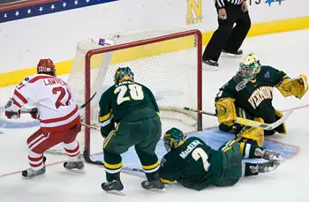 Chris Higgins' goal goes in off Drew MacKenzie's stick. Photo by Melissa Wade.