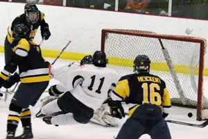 Neumann freshman Jeremy Gates scores with a rocket from the point (photo: Angelo Lisuzzo).