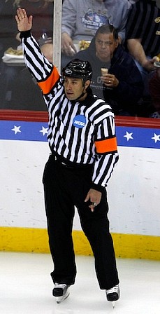 Referee Marco Hunt raised his arm repeatedly Saturday night, but to little effect on the scoreboard (photo: Jim Rosvold).