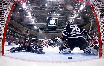 Jerry Pollastrone reaches in vain for the puck as Jason Lawrence's winning goal gets through (photos: Melissa Wade).