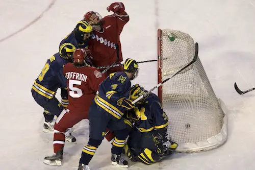 Wisconsin's Jordy Murray puts in a rebound to put the Badgers ahead 1-0.  Photo by Jim Rosvold.