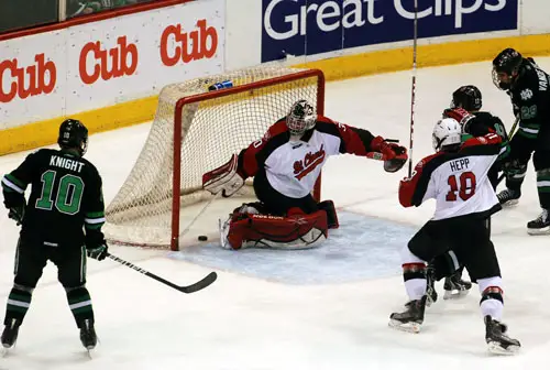 St. Cloud State goaltender can't squeeze his pads in time to stop Danny Kristo's power-play goal (photo: Tim Brule).