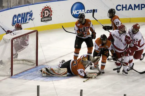 John Mitchell (24) scores Wisconsin's first goal just 1:27 into the game (photo: Jim Rosvold).