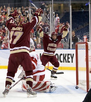 Brian Gibbons (left) and Cam Atkinson celebrate Boston College's first goal past Wisconsin goaltender Scott Gudmandson on Saturday (photo: Melissa Wade).
