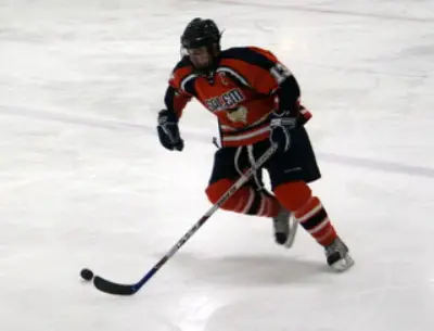 Salem State forward Damen Nisula driving the net towards the goal.  His shot on this play tied it 3-3 (photo: Matthew Webb).