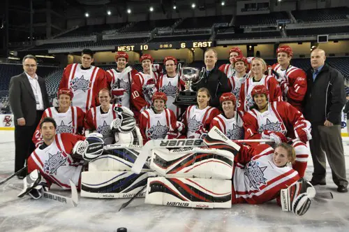 The West piles around the trophy for winning the Frozen Four Skills Challenge (photo: Candace Horgan).