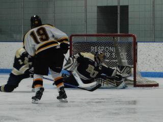 Gustavus Adolphus's Brad Wiek (19) scores the game tying goal against Bethel.