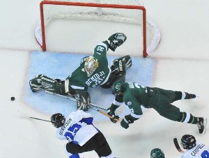 Bemidji State's Dan Bakala comes up with a toe save on Alabama-Huntsville's Kevin Morrison last Sunday (photo: Doug Eagan).