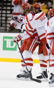 Boston University's Eric Gryba and Kevin Shattenkirk celebrate their Beanpot semifinal win over Northeastern (photo: Melissa Wade).