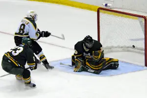 Cody Keefer scores the winning goal for St. Norbert with 39.4 seconds left. Photo by Angelo Lisuzzo. 