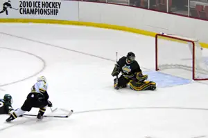 Johan Ryd scores the first goal of the game for St. Norbert. Photo by Angelo Lisuzzo. 