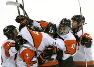 RIT players celebrate Mike Janda's goal that put the Tigers up 2-0 in the first period (photo: Michelle Bishop).