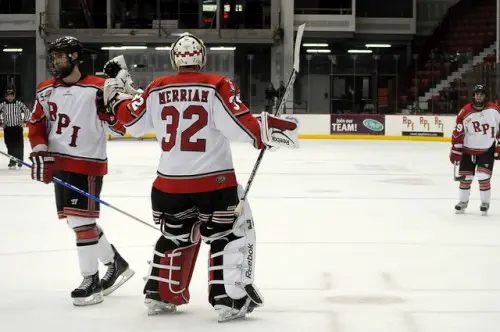 Mike Bergin celebrates Rensselaer's lone goal with goaltender Bryce Merriam (photo: Jennifer Bock).