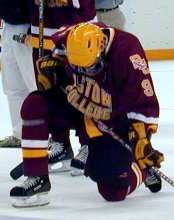 Mike Mottau kneels in dejection following BC's title game loss to North Dakota