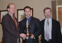 Colgate's Andy McDonald (center) accepts his award as ECAC Player of the Year.