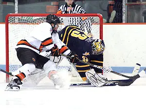 Eric Hartzell (Quinnipiac - 33) makes a save on Rob Kleebaum (Princeton - 39).  Hartzell stopped 34 of 35 shots to help Quinnipiac earn a 1-1 tie with Princeton at Hobey Baker Rink, in Princeton, NJ. (Shelley M. Szwast)