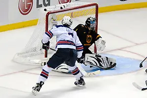 2010 IIHF World U20 Championship - #3 Charlie Coyle scored the first USA goal over the right shoulder of #1 Philipp Grubauer. Note the puck at the post; Copyright 2010 Angelo Lisuzzo (Angelo Lisuzzo)
