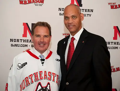 New Northeastern coach Jim Madigan poses with athletic director Peter Roby. (Mike Mazzanti - Northeastern University)