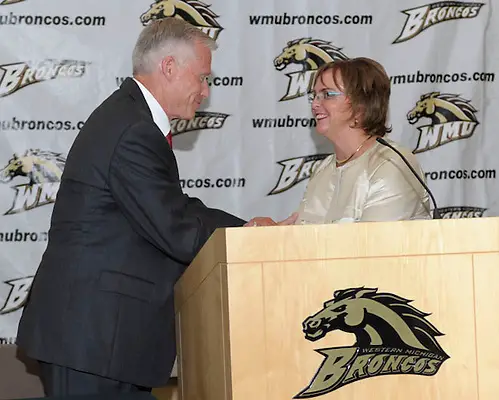 New Western Michigan coach Andy Murray greets athletic director Kathy Beauregard. (GARY SHOOK)