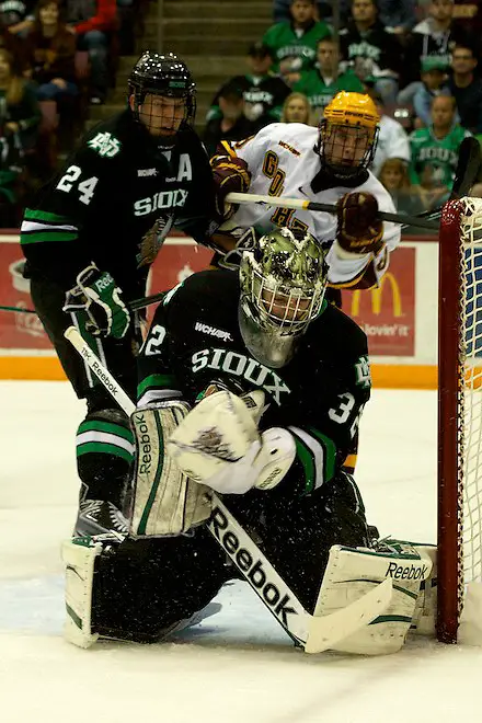 6 Nov 11: Ben Blood (North Dakota 24), Aaron Dell (North Dakota - 32), Erik Haula (Minnesota - 19) The University of Minnesota Golden Gophers host the University of North Dakota Fighting Sioux in a WCHA matchup at Mariucci Arena in Minneapolis, MN. (Jim Rosvold)