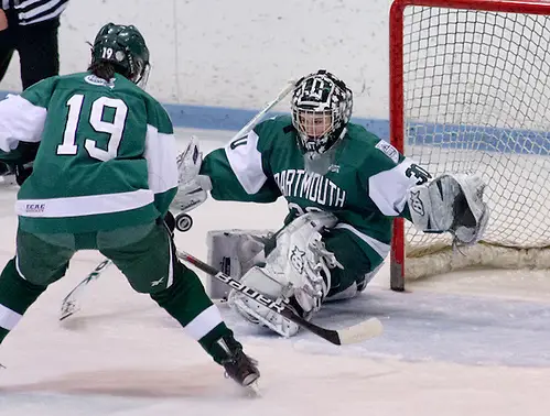 Lindsay Holdcroft ((Dartmouth - 30) makes a save as Reagan Fischer ((Dartmouth - 19) skates in to play the rebound. Princeton and Dartmouth tied 2-2 at Hobey Baker Rink in Princeton, N.J. (Shelley M. Szwast)