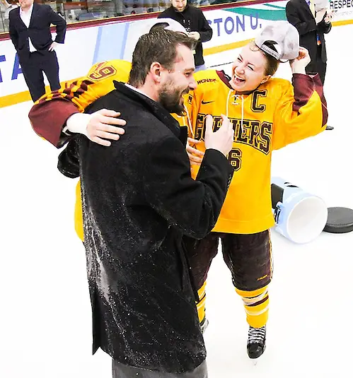 Minnesota Head Coach Dave Frost reacts to being hit with water after the game at the 2013 NCAA Women's Frozen Four Championship game at Ridder Arena in Minneapolis on March 24, 2013... (Ryan Coleman/Ryan Coleman, USCHO.com)